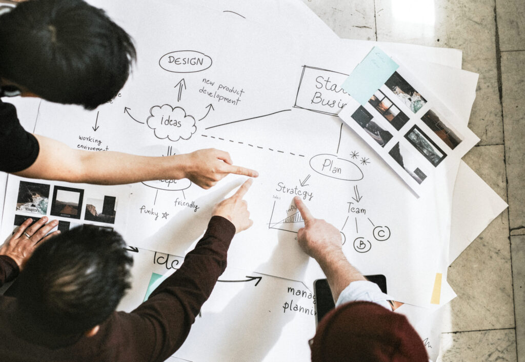 Startup team brainstorming ideas and strategy for a new product development plan.
