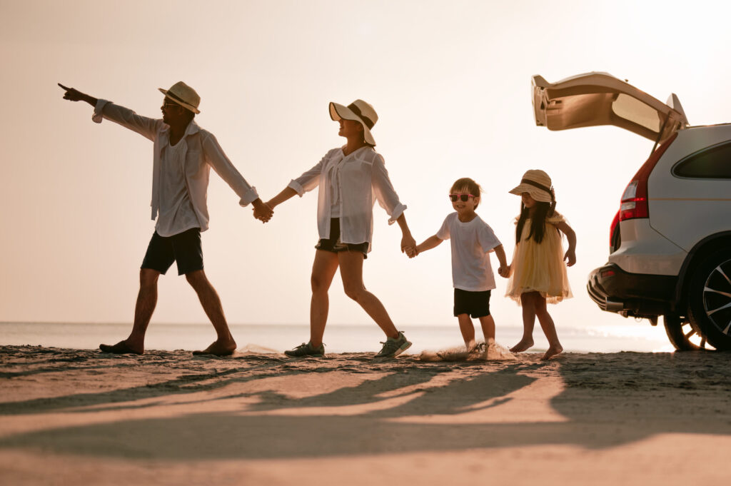 Asian family on beach vacation, bonding and creating memories on a family day trip.