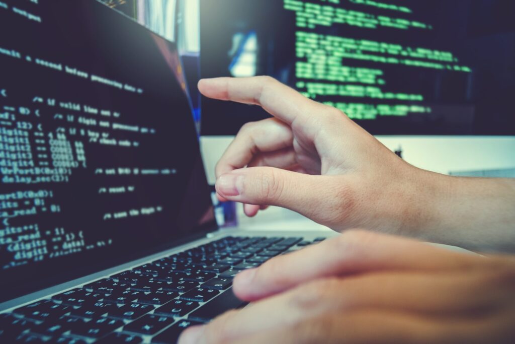 Programmer developing software illustrating business technology solutions.