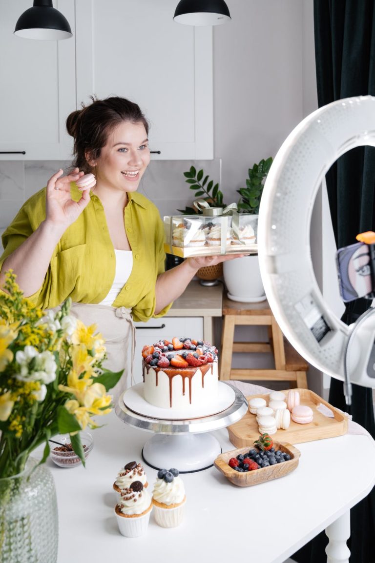 a woman standing in front of a cake