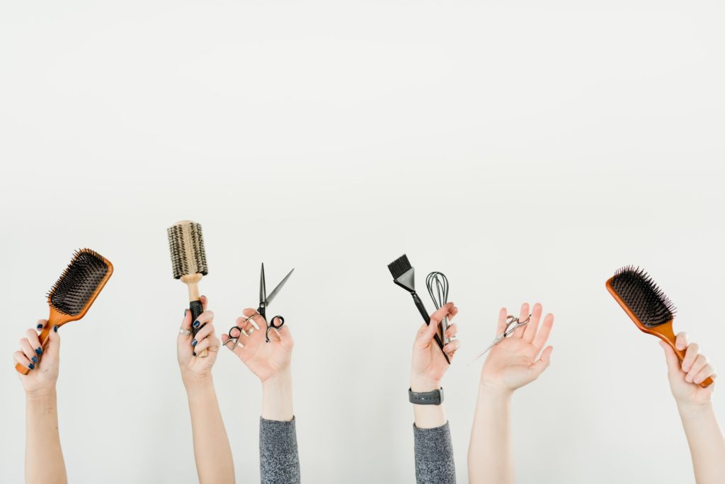 a group of hands holding microphones