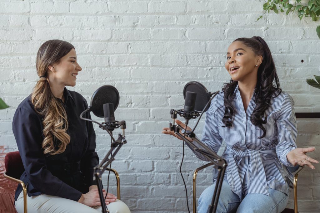 a couple of women sitting in chairs