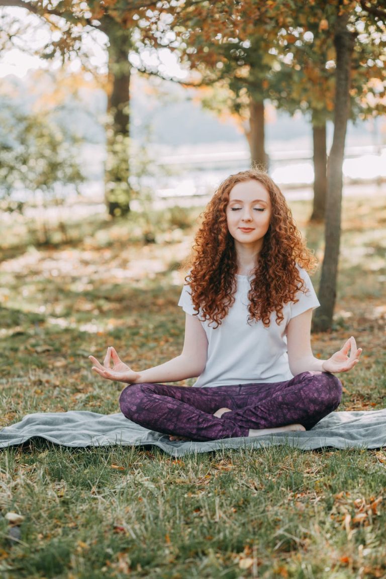 a person sitting on a rock