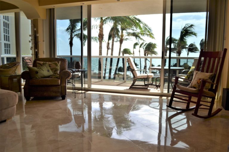 a living room with a patio and a pool