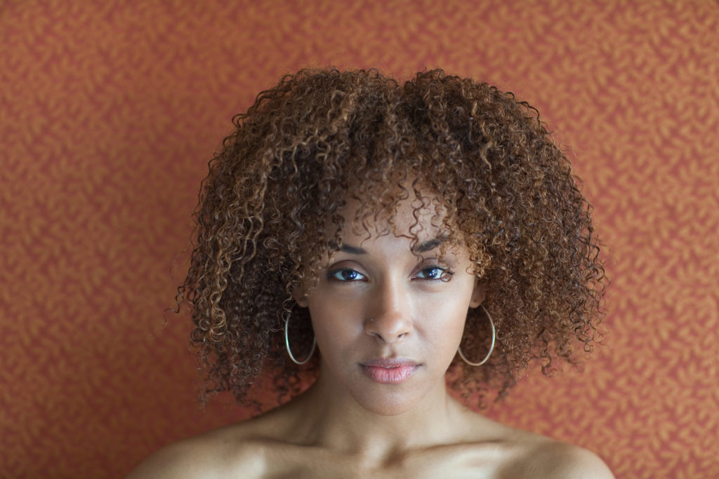 Portrait of a young woman looking sultry